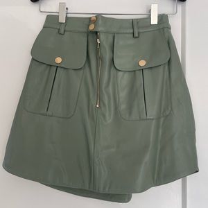 Women’s faux leather mini Trish skirt by Egreis NWOT size small in sage